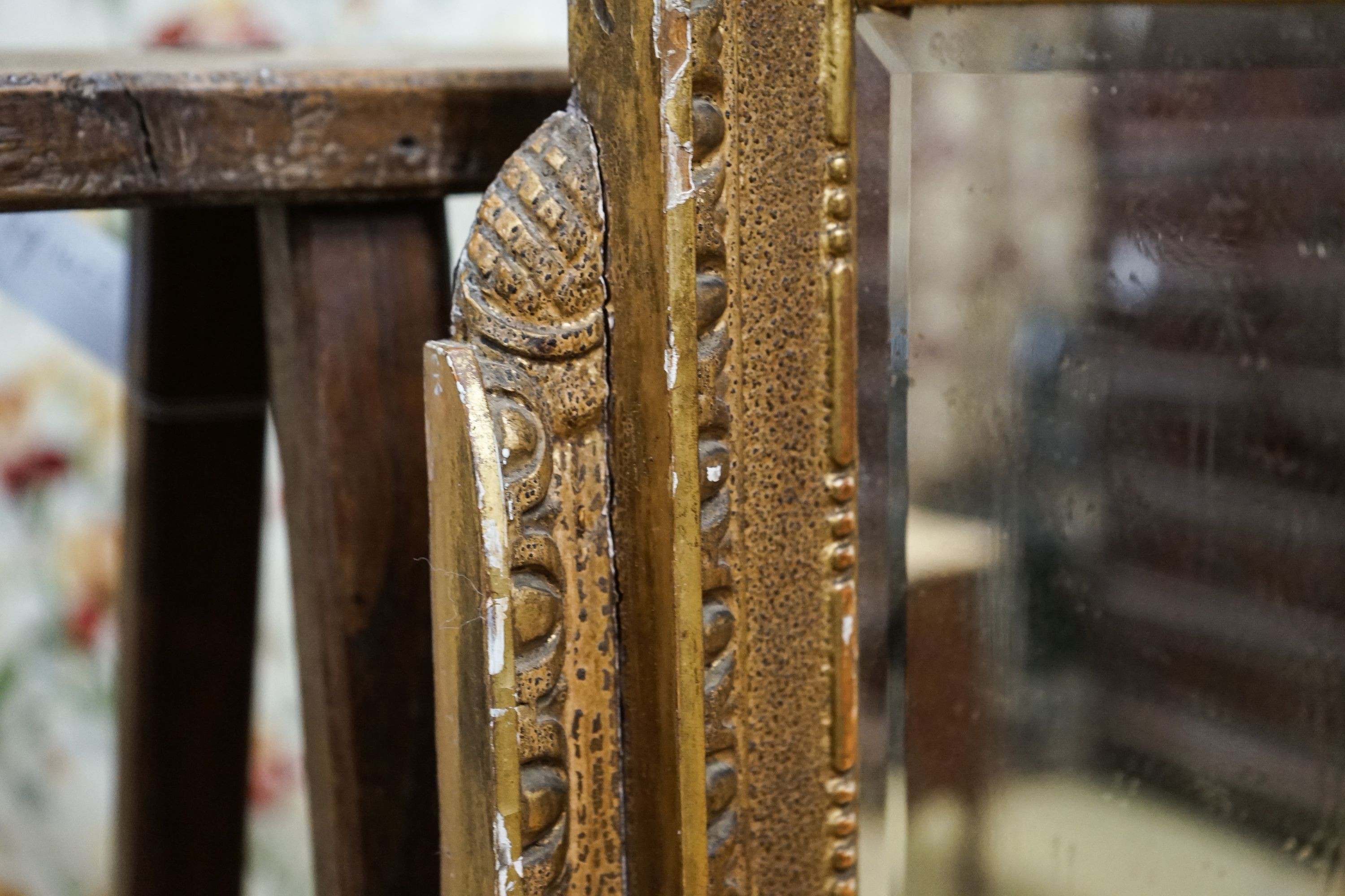 A 19th century giltwood and gesso triple plate overmantel mirror, width 164cm, height 49cm